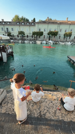 Summer evening along the canals of Peschiera del Garda