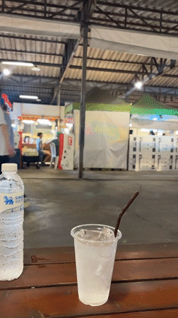 Diner enjoys meal at Bangkok night market