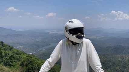 Motorcyclist poses against mountain view in Nam Hải Vietnam