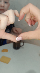 Heart gesture shared at table gathering in Tobolsk