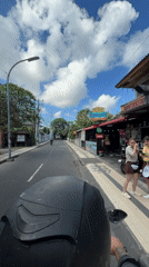 Morning motorcycle ride documented through Kuta streets and local establishment