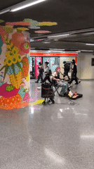Street musician performs in Barcelona subway station