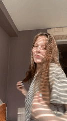Woman photographed in sunlit indoor spaces in Ufa
