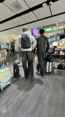 Group moves through Gatwick Airport ahead of a morning departure.