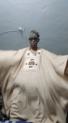 Traditional attire, mirror fragments, and selfies in Lagos