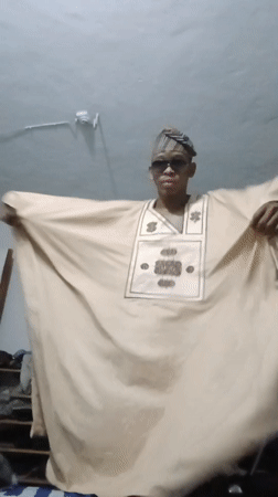 Traditional attire, mirror fragments, and selfies in Lagos