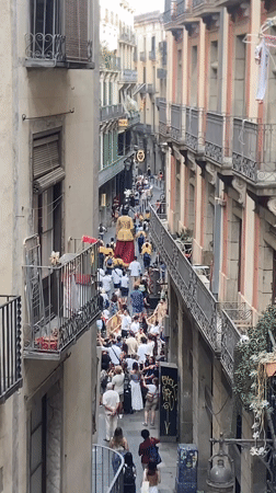 Street procession and market bustle in central Barcelona