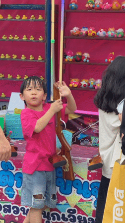 Chiang Mai fair day: carnival rides, shooting games, and a gym class