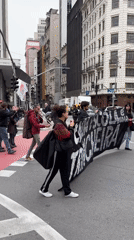 Education workers demonstrate in São Paulo streets with union banners