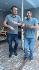 Men dance at pool patio during afternoon gathering