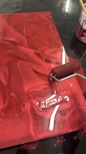 Metallic red liquid rolled across a dark surface in El Paso