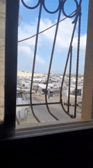 Daily life moves through a crowded displacement camp in Khan Yunis