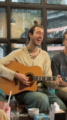 Acoustic guitarist performs informal session at Pokhara cafe