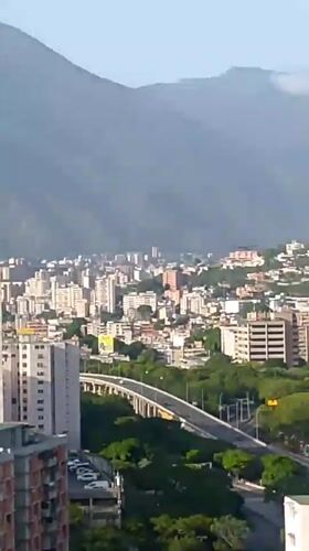 Caracas hillside neighborhoods seen from above and street level