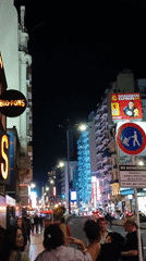 Busy night street activity captured in Buenos Aires