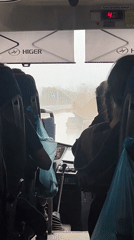 Heavy rain hits Yanychi as bus passengers travel