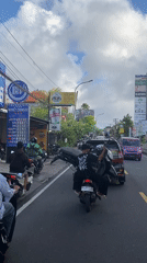 Slow motorbike traffic recorded in Bali tourist area