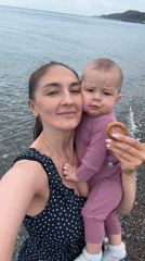Mother and baby enjoy beach outing in Sochi
