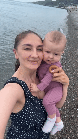 Mother and baby enjoy beach outing in Sochi