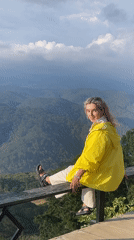Tourist couple photographs mountain scenery in Phát Chi Vietnam