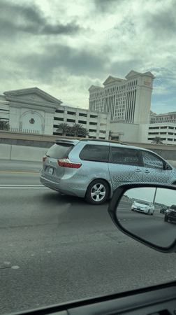 Driver passes Caesars Palace on Las Vegas highway