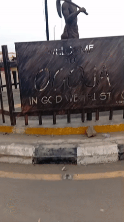 Rural Nigerian town scenes documented near Ocoja welcome sign