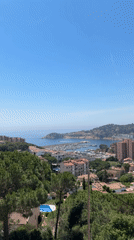 Tourist documents harbor visit in Sant Feliu de Guíxols