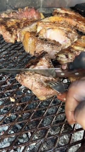 Outdoor beef barbecue observed in Merlo, Argentina