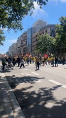 Yellow-shirted protesters march through Barcelona streets with union banners