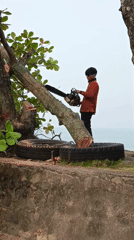 Street vendors and chainsaw work on a Padang street
