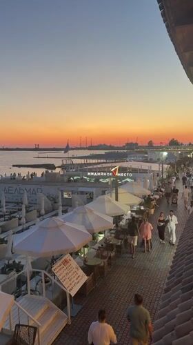 Sochi waterfront at golden hour — promenade, food, and sea views