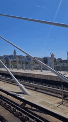 Morning commute documented from elevated transit station overlooking city