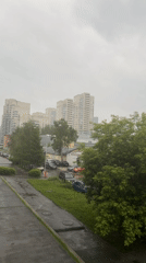 Wet concrete path documented in Yekaterinburg during cloudy conditions