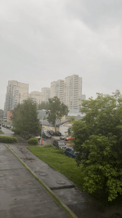 Wet concrete path documented in Yekaterinburg during cloudy conditions