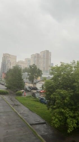 Wet concrete path documented in Yekaterinburg during cloudy conditions