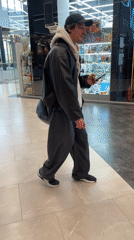 Mall visitor browsed displays while walking through Murino shopping center