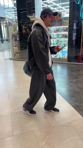 Mall visitor browsed displays while walking through Murino shopping center