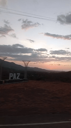 Sunset displays vibrant colors over mountainous landscape
