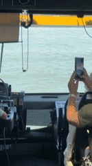 Duck Tour bus navigates Rotterdam waterways, water splashing the windows