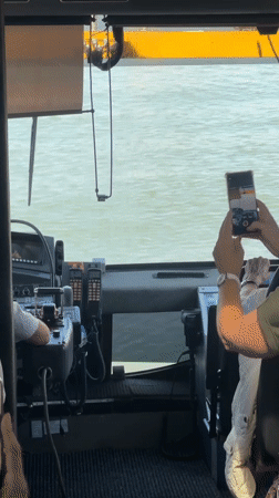 Duck Tour bus navigates Rotterdam waterways, water splashing the windows