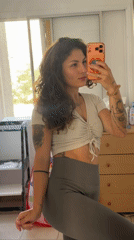 Woman takes mirror selfies in Kiryat Bialik home