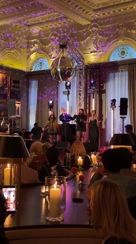 Live vocal performance at a dimly lit London supper club