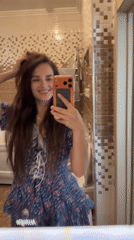 Bathroom mirror selfie session in a floral dress, Ufa