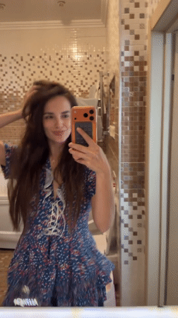Bathroom mirror selfie session in a floral dress, Ufa