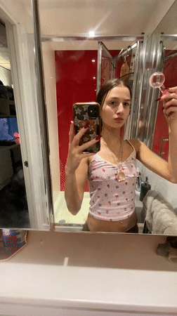 Woman takes selfies in London bathroom Monday evening