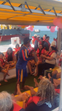 Tourist catamaran entertainment captured in Venezuelan coastal town