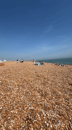 Sunny beach day brings crowds to Folkestone pebble shores