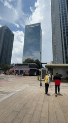 Street-level scenes around a Huizhou commercial plaza