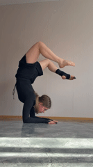 Woman practices gymnastics routine indoors in Perm, Russia