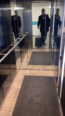 Traveler with luggage spotted in Berlin elevator